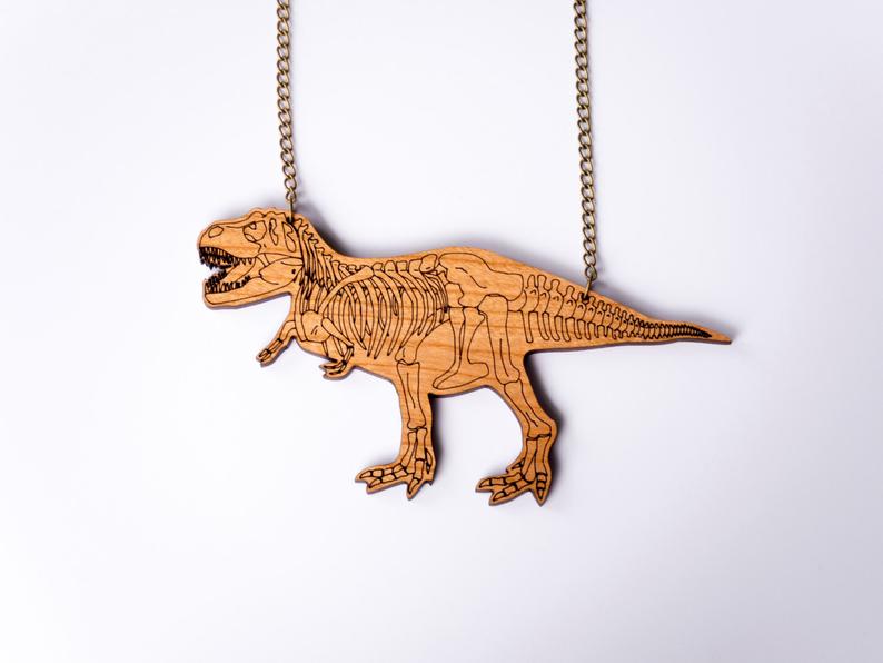 cherry wood t rex statement necklace with skeleton etched design