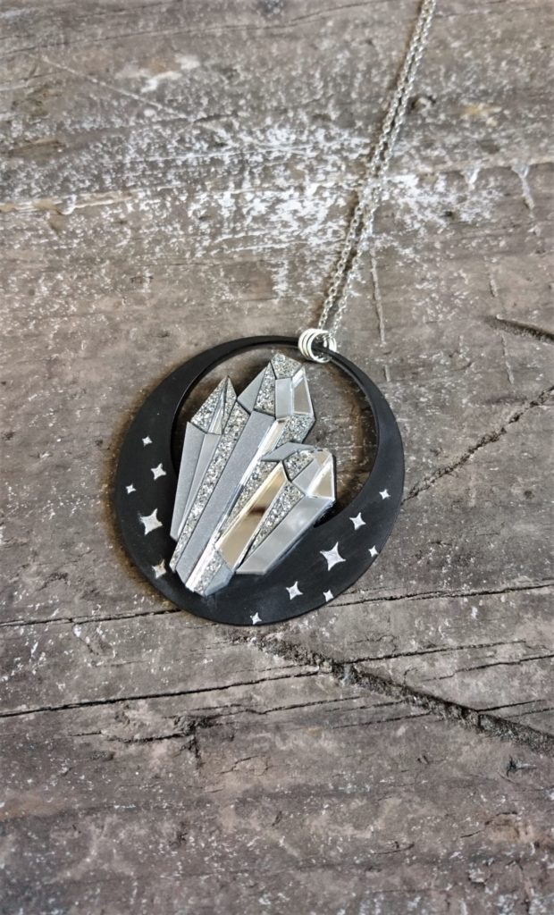 black and silver acrylic pendant necklace in the shape of crystals