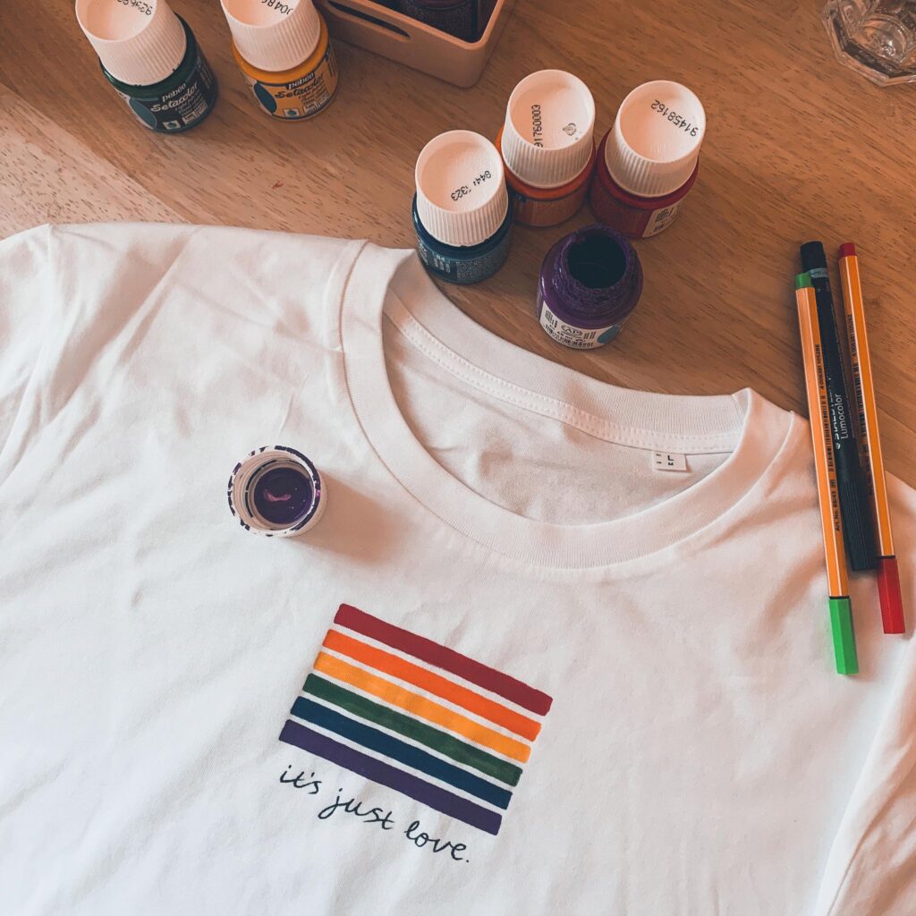 white tshirt with hand painted rainbow flag